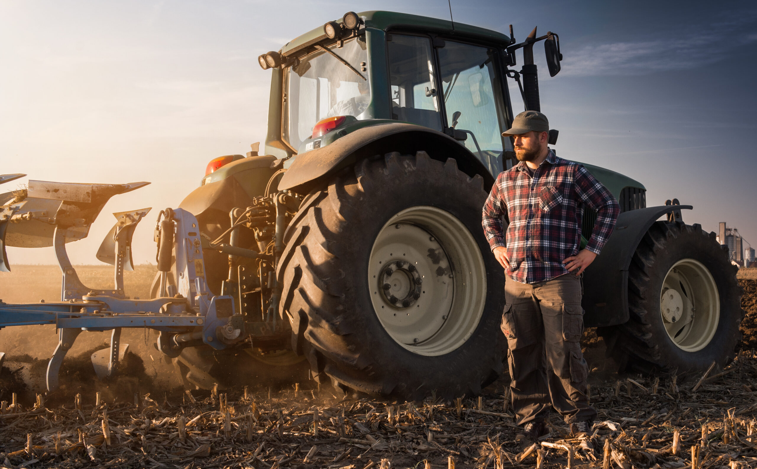 Young,Farmer,Working,During,The,Tractor,Plowing,Fields,-preparing,Land